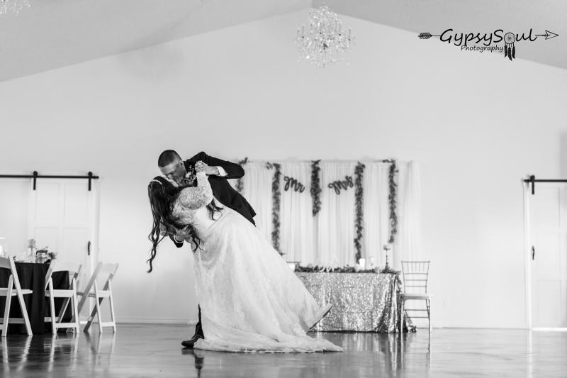 bride and groom kissing on dancefloor 